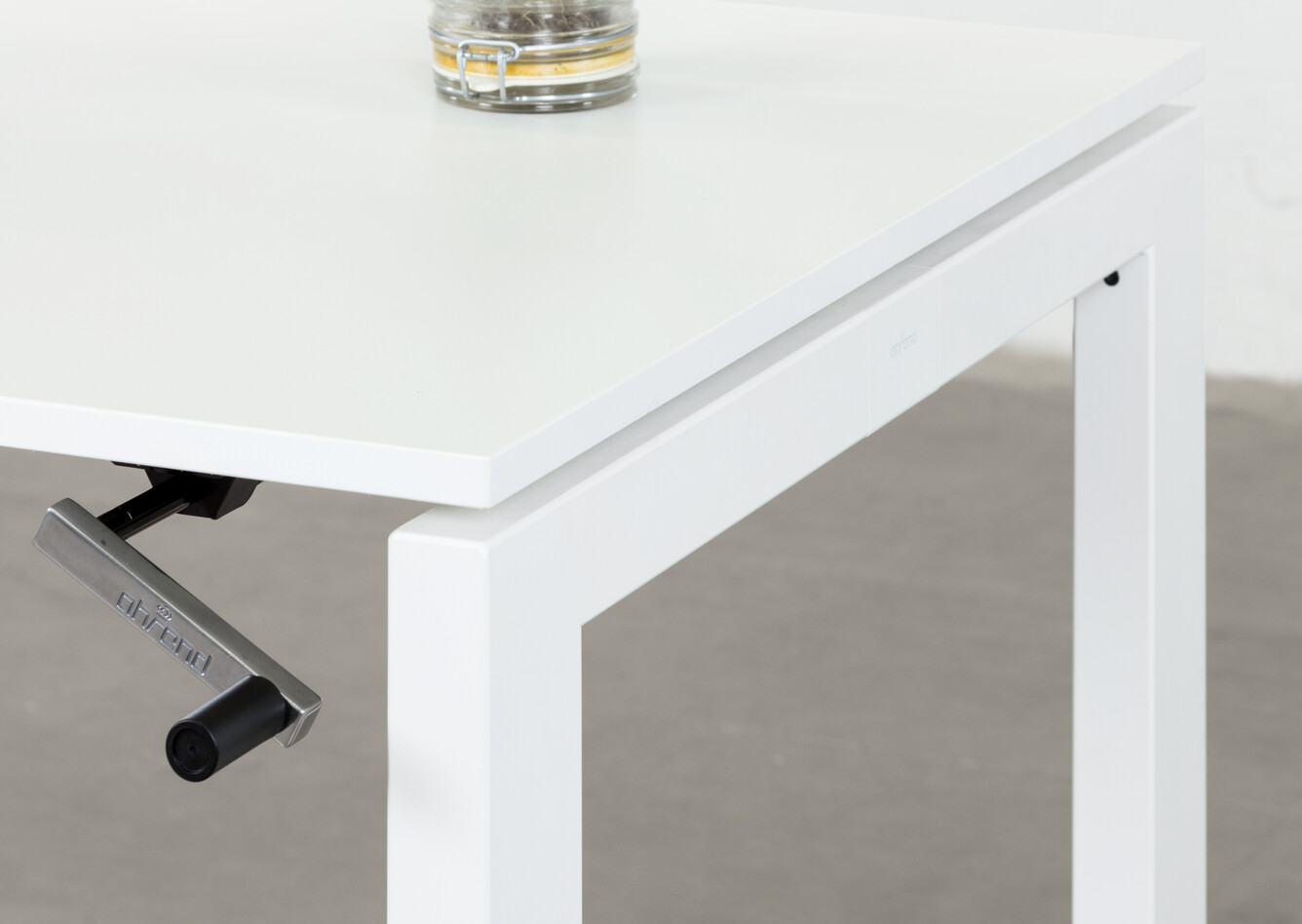 Royal Ahrend Balance 4 leg in white with crank and glass jar with plant front right detail view