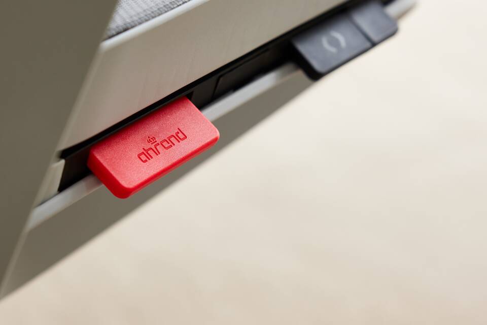 Ahrend Remode office chair in grey close up of height adjustment left rear detail view