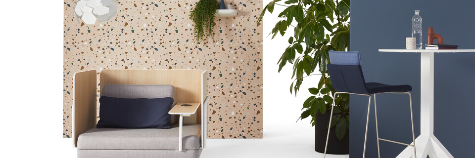 Gispen STEE armchair in white upholstered in grey with white Dukdalf high table and Triennial High 65 upholstered in blue with thunderball lamp front view