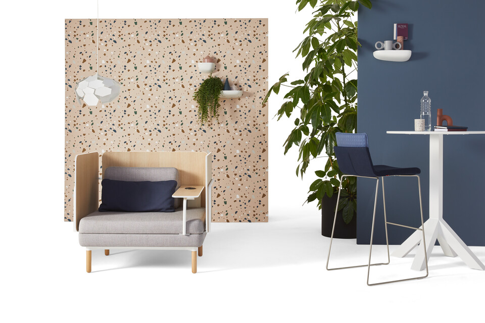 Gispen STEE armchair in white upholstered in grey with white Dukdalf high table and Triennial High 65 upholstered in blue with thunderball lamp front view