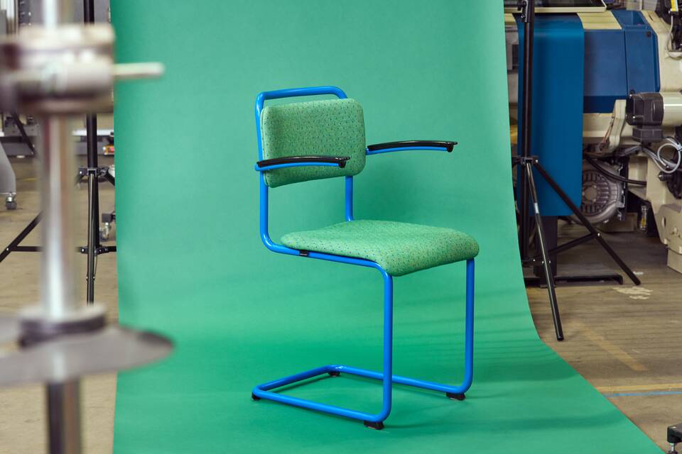 Gispen Classics 201 chair in blue with green limited edition upholstered seat and back zoomed in front left view