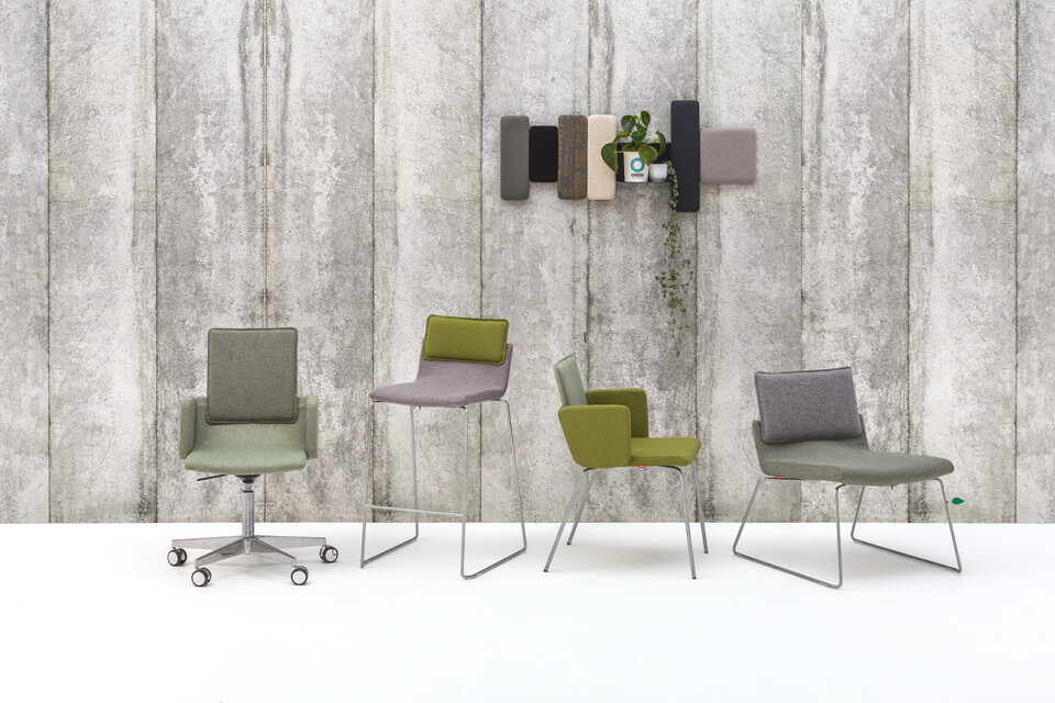 Gispen Triennial chairs extra sustainable fabrick selection in front of concreet wall front view
