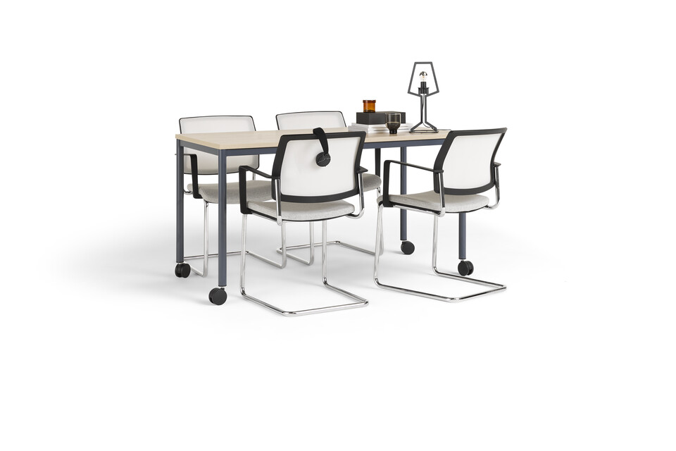 Gispen UT round 4 leg table in blue with oak tabletop on castors and grey ZINN conference chairs styled front left view