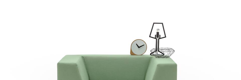 Gispen Sett low armchair in divina 856 green and Outline table lamp front view