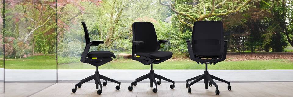 Ahrend Remode office chairs in black in different configurations with trees in background header front left side and rear view