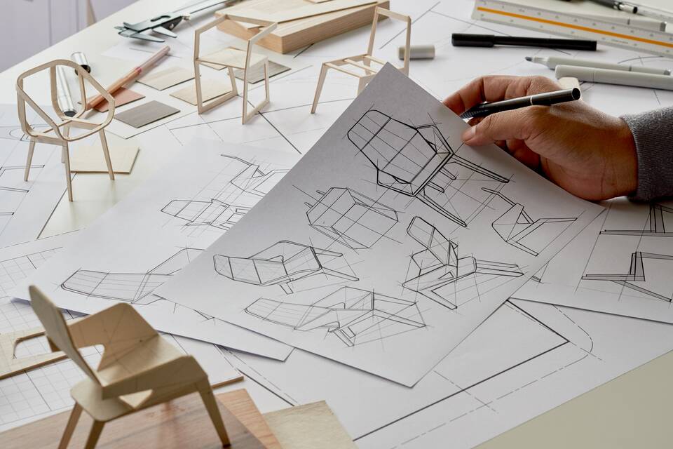 Designer sketching drawing design development product plan draft chair armchair Wingback Interior furniture prototype manufacturing production. designer studio concept
