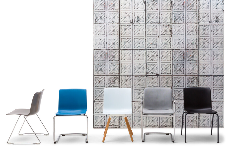 Gispen Nomi chairs with grey stone background front view