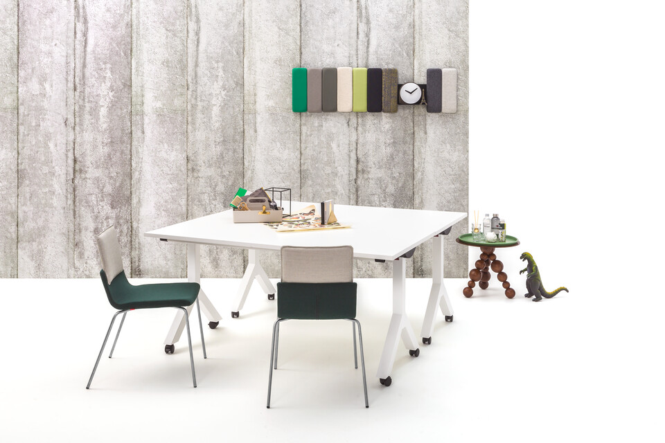 Gispen Dukdalf folding tables with Triennial Classic chairs and Bor sidetable with Asy serving tray in front of concrete backpanel front view
