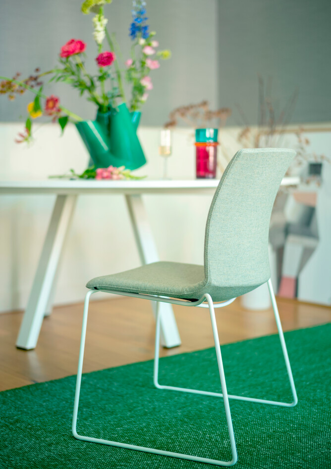 Royal Ahrend Well sled base chair fully upholstered in green at Kvadrat store in Amsterdam L1000856