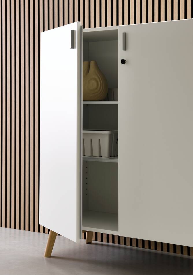 Techo Hyll cabinet in white with birch legs and door open with styling front right detail view