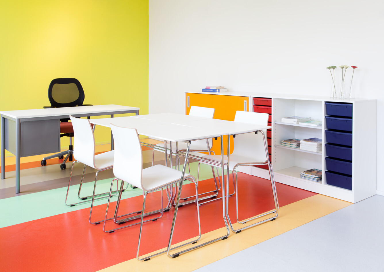 456, 370 Royal Ahrend 456 seminar tables with chrome frame and white tops with 370 wireframe chairs in classroom front right view