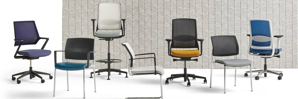 Gispen ZINN office and visitor chairs collection in different colours with ZINN Multi in front of backpanel for web front view