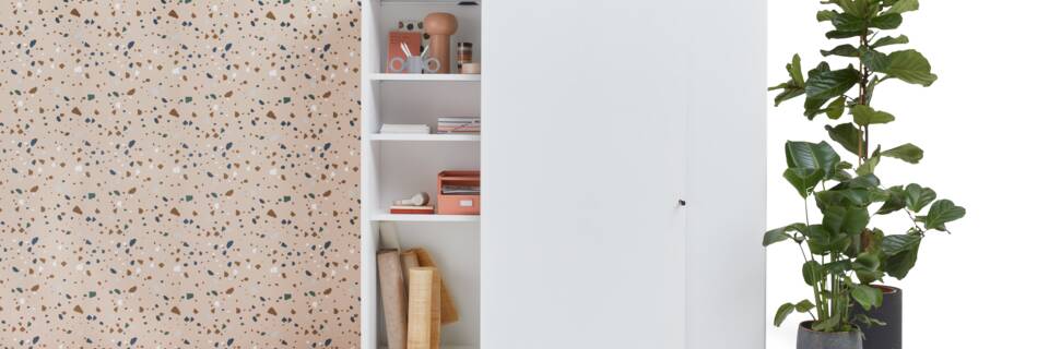 Gispen SDK sliding door cabinet high in white with left door partially open styled with backpanel front view