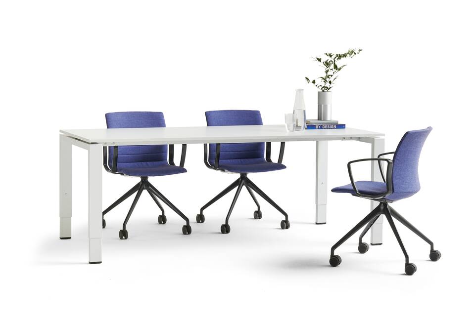 Portal, Well Ahrend Portal table in grey with grey tabletop and Well chairs in black awith blue upholstery styled front left view