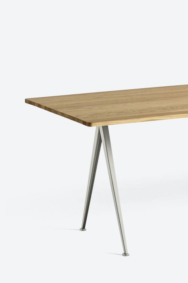 Ahrend Pyramid table on grey background front left detail view
